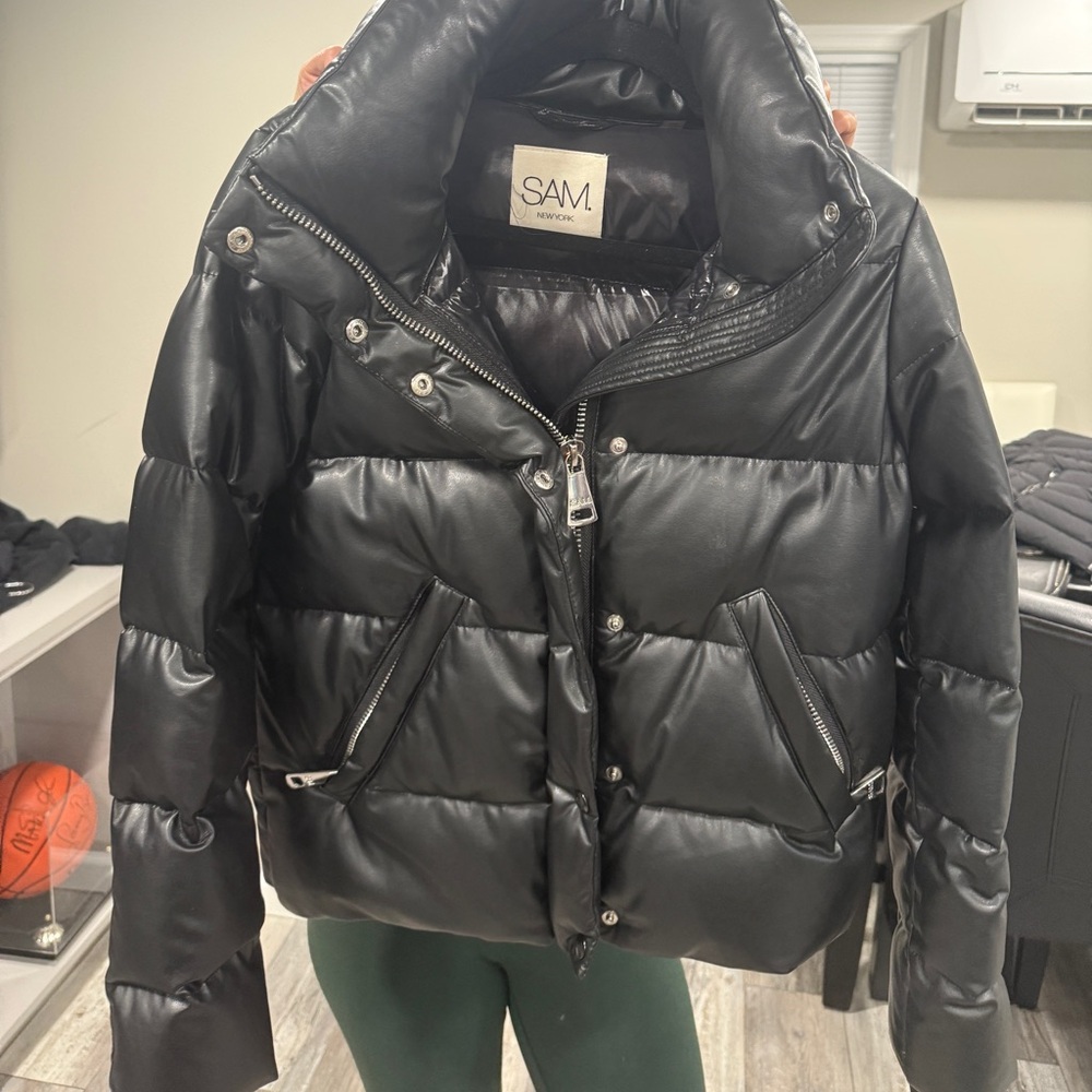 Women’s black faux leather SAM jacket.